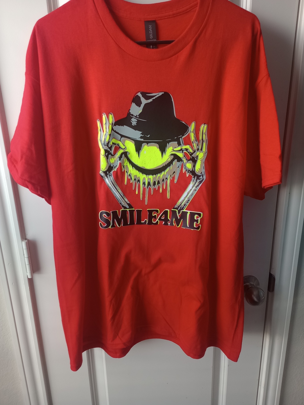 Custom Red Vinyl Graphic Tee with Neon Smile Design